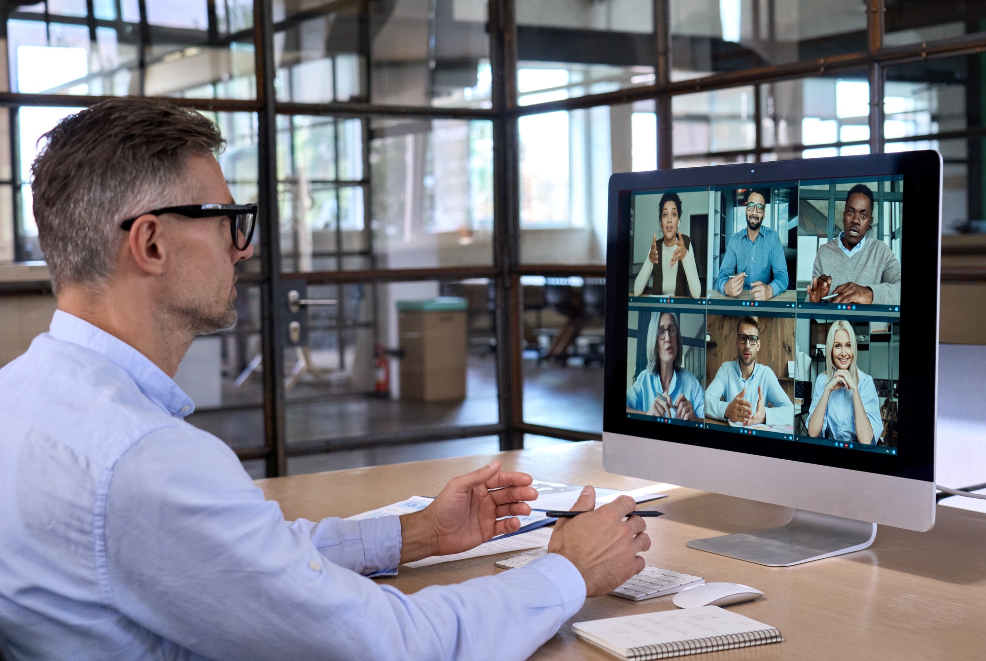 Caucasian executive ceo businessman having working video call in global office.