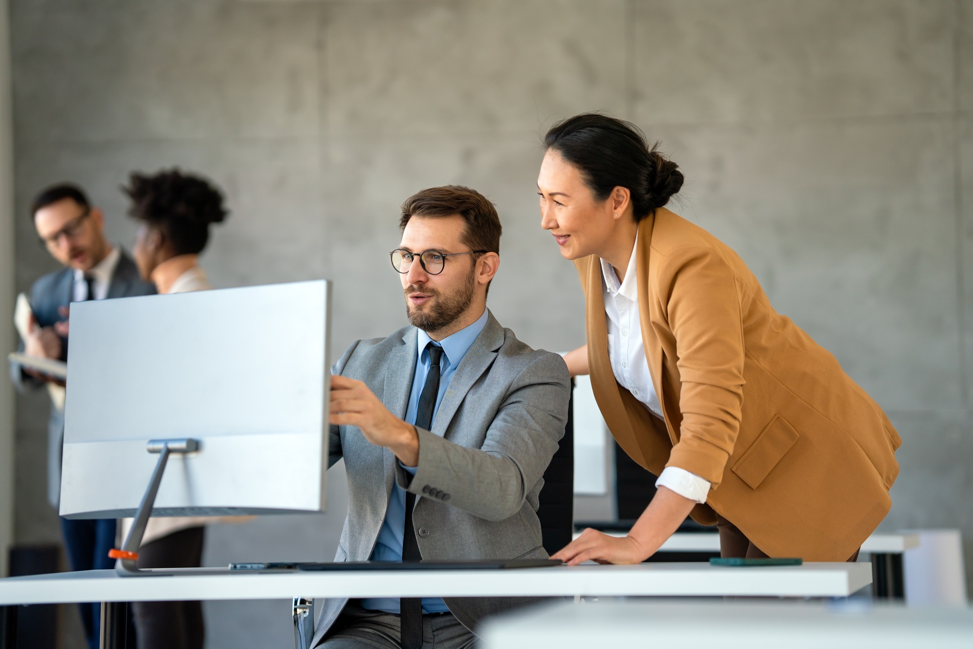 Group of diverse multiethnic business people and software developers working as a team in office